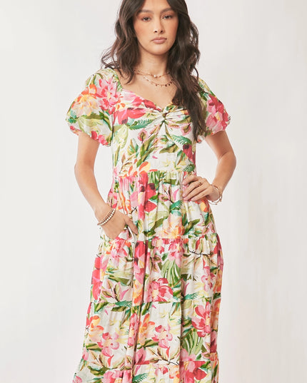 Woman wearing a colorful floral dress on a white background