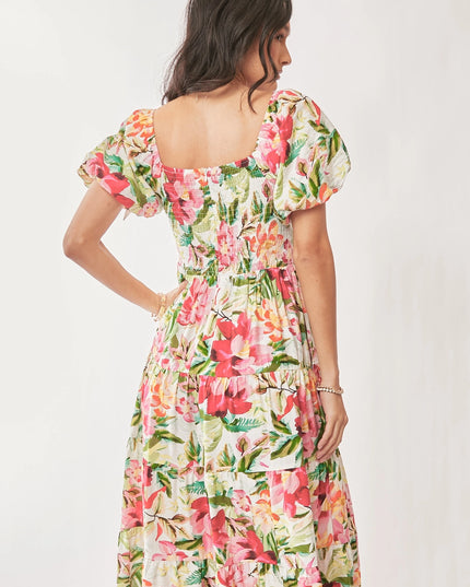 Woman wearing a floral dress on a white background
