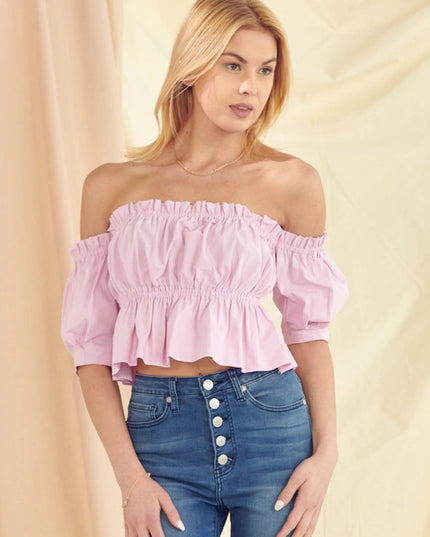 Blush pink feminine blouse styled with high waisted jeans