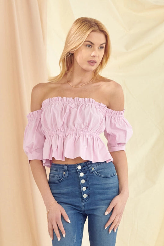Blush pink feminine blouse styled with high waisted jeans