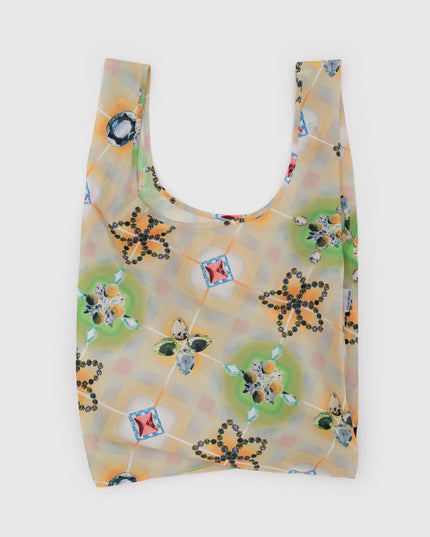 Reusable bag with floral and geometric pattern on a white background