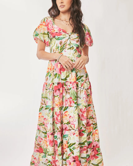 Woman wearing a floral dress against a white background