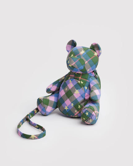 Plaid patterned teddy bear with a strap on a white background