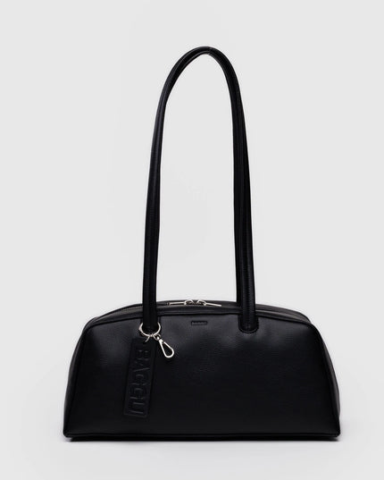 Black handbag with a handle on a light gray background