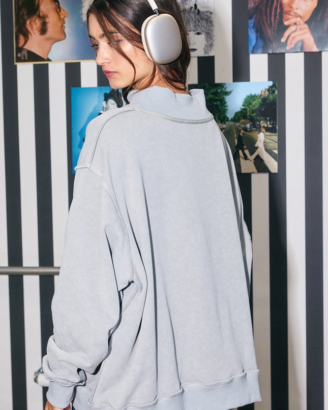 Back view of gray reversible oversized sweatshirt