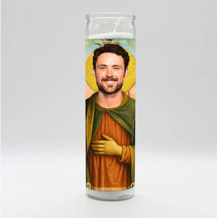 Candle with a printed design of a person on a white background
