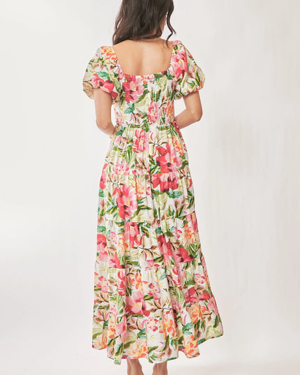 Woman wearing a floral dress on a white background