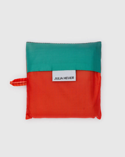 Green and red pouch with 'Julia Heuer' label on a white background