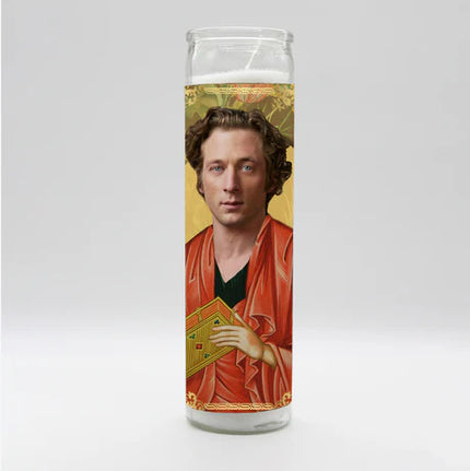 Candle with a portrait of a person on a gold background