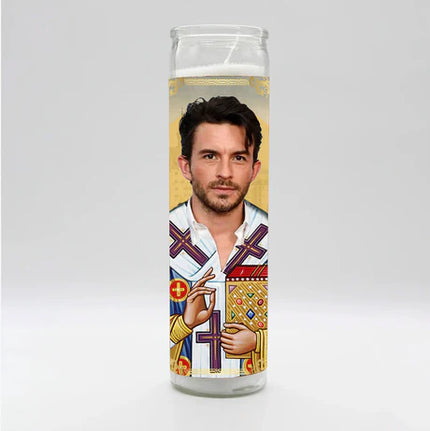 Candle with a printed design of a person on a white background