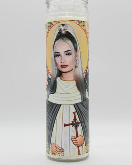 Candle with a portrait of a person holding a cross on a white background