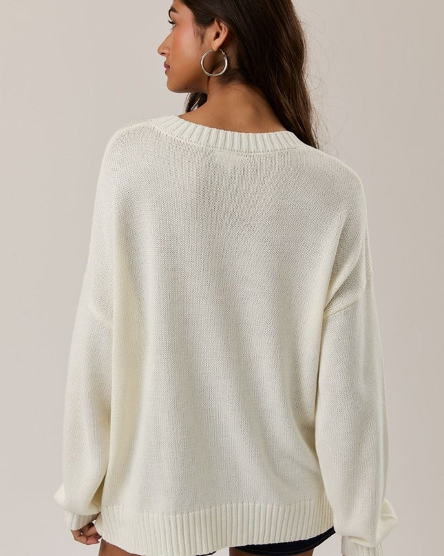 Sold cream back of sweater