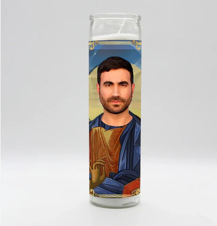 Candle with a portrait of a person on a religious-style background