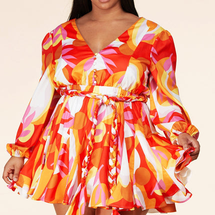 orange and yellow 70s geo print vintage inspired long sleeve dress with braided belt and vanity buttons on a v neck